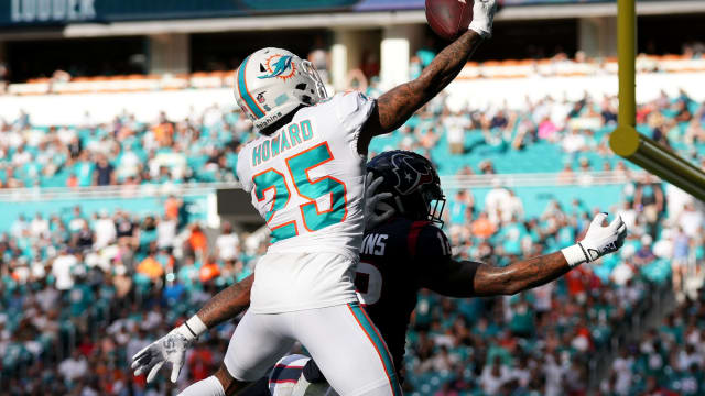 Nov 27, 2022; Miami Gardens, Florida, USA; Miami Dolphins cornerback Xavien Howard (25) breaks up a pass for Houston Texans wide receiver Nico Collins (12) during the second half at Hard Rock Stadium.